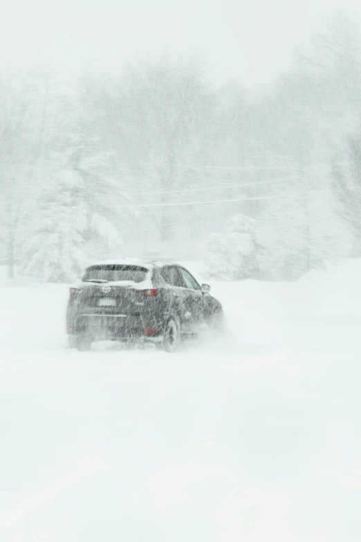 a vehicle that is driving in some snow