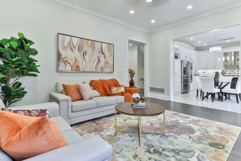 living room with couches, tables, and various chairs