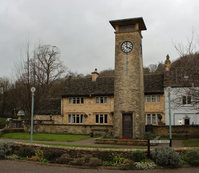 a clock tower with two clocks at the top