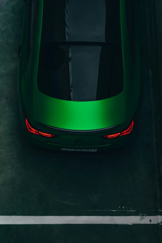 the rear end of a vehicle with bright green paint