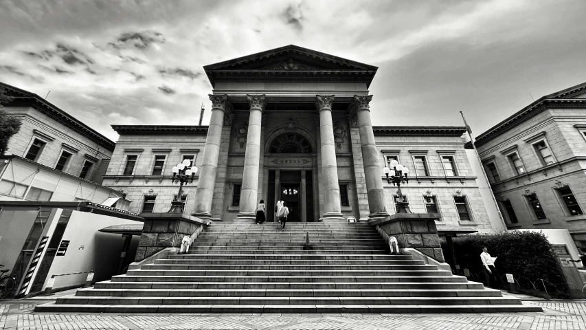 black and white pograph of the steps leading up to the front entrance of a building