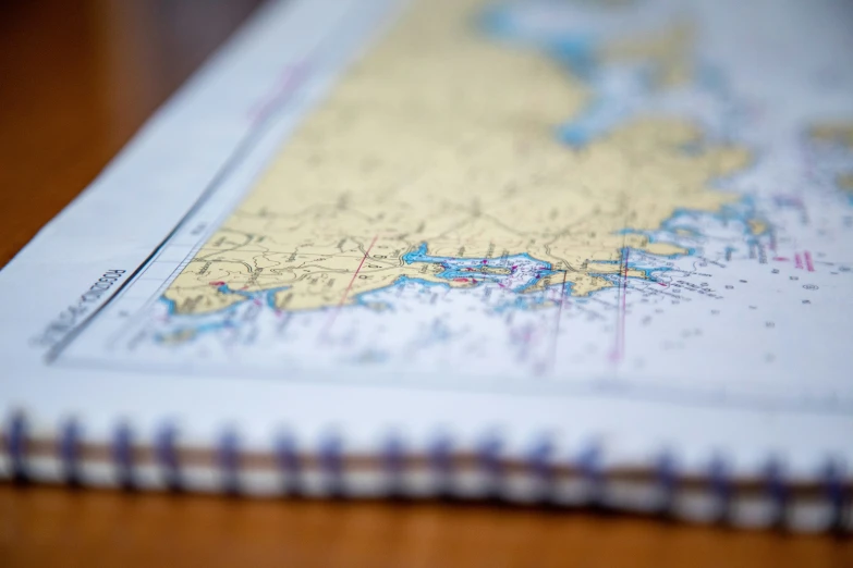 a travel book with a map sitting on it