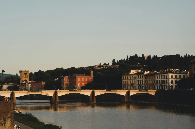 view of a bridge over the water with buildings lining it