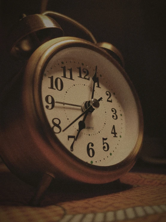 a picture of a clock and keyboard on the table