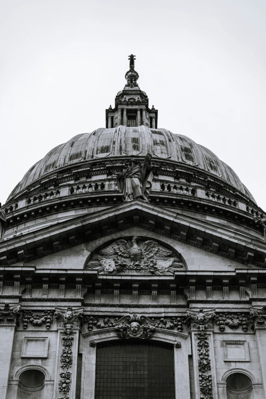 a large stone dome with a clock on top