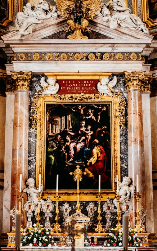 an ornate shrine with large painting over it