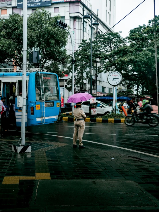 people walking on the street with umbrellas on the rainy day