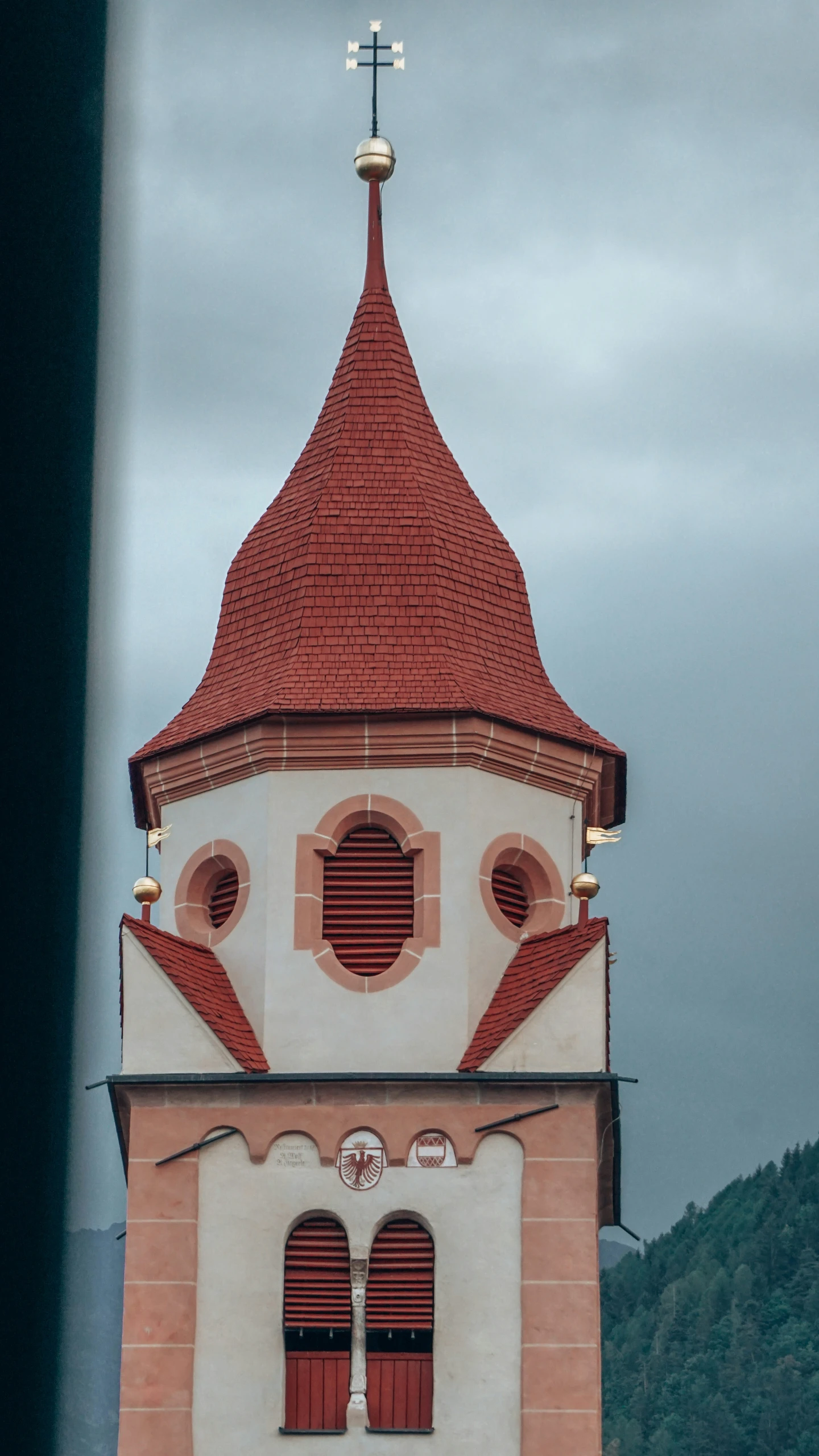 there is a church steeple with windows