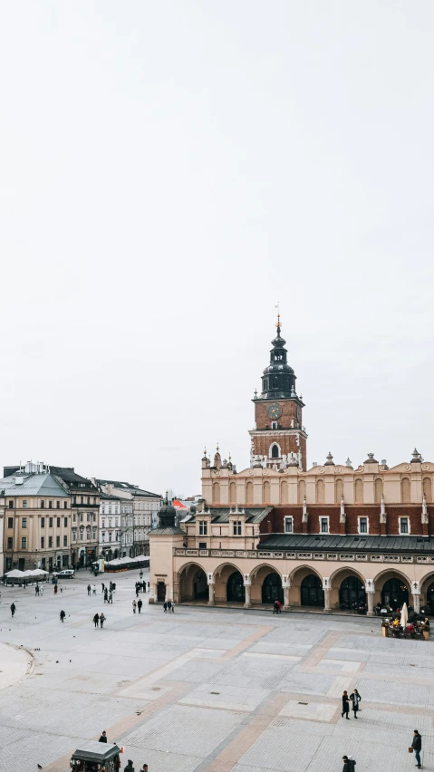 people walk around in a courtyard of the old town