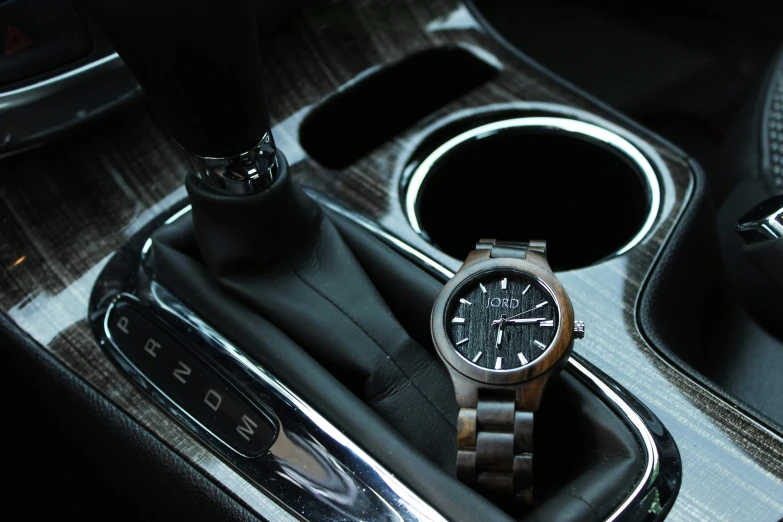 a watch sits in the middle of a car