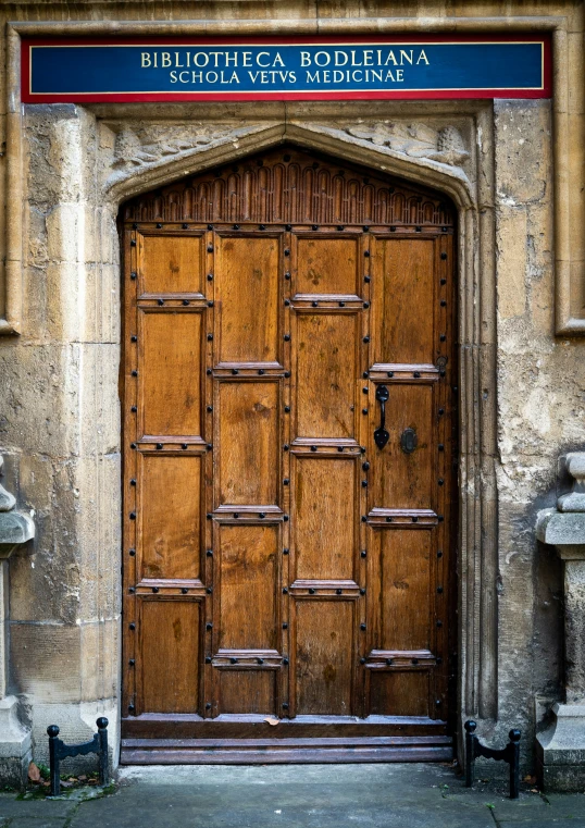a wooden door leading into an old building