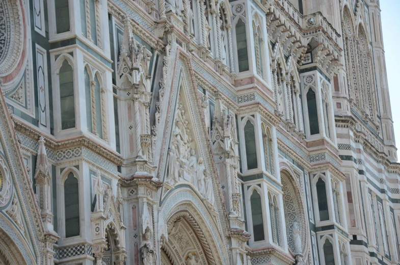 closeup of a building with many windows and elaborate carvings on it