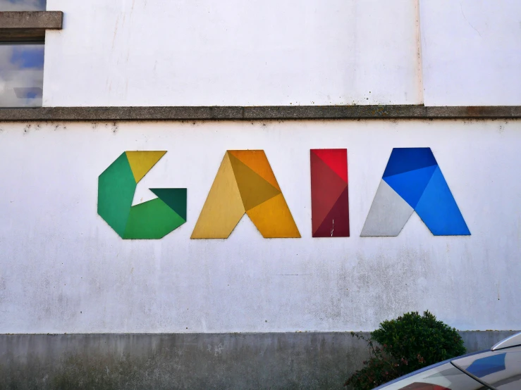 the word gaia written in multicolored letters on a building