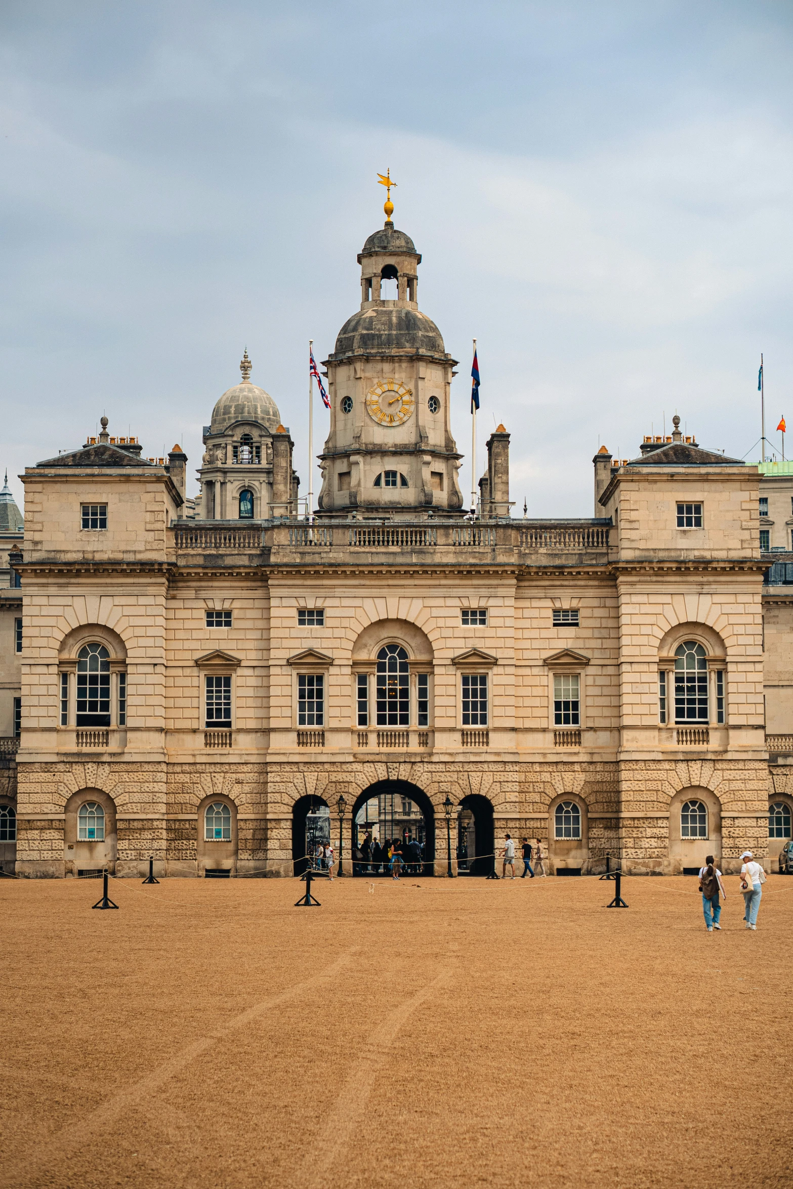 the exterior of an ornate palace with a clock tower