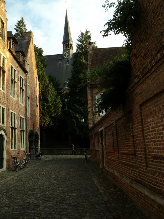 the old stone street is lined with brick buildings