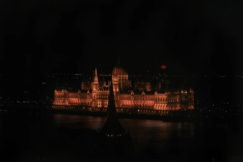 night image of a large building over water