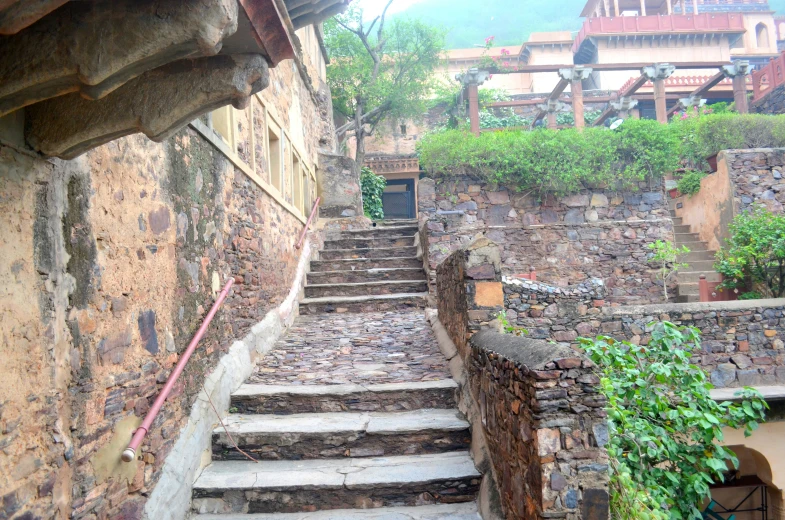 there is a stone staircase on the side of an old building