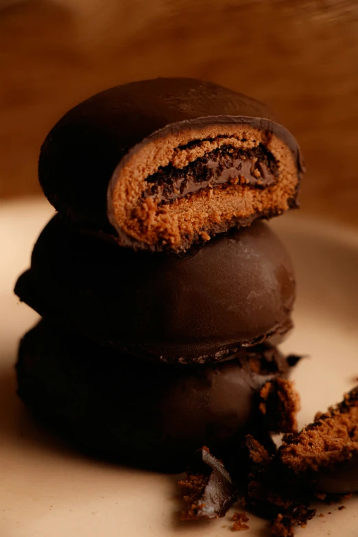 a white plate topped with chocolate covered cookies