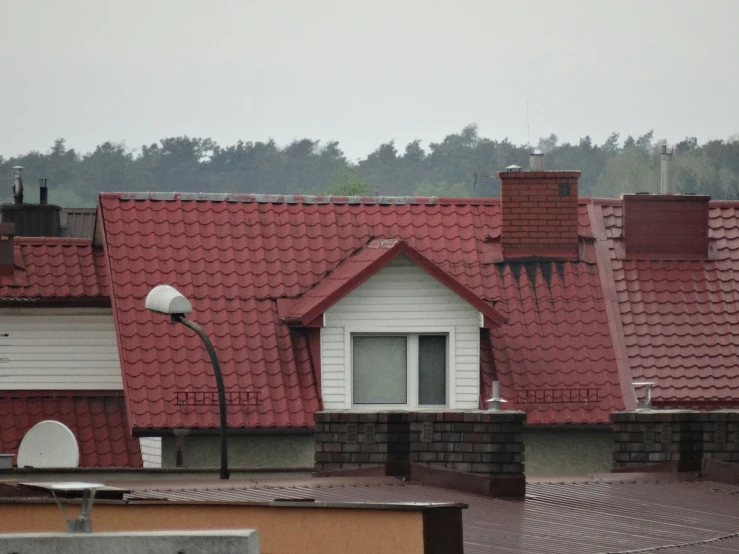 two houses next to each other with red roofs