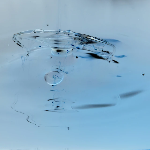 a blue and white po of a clock, water drops and the bottom