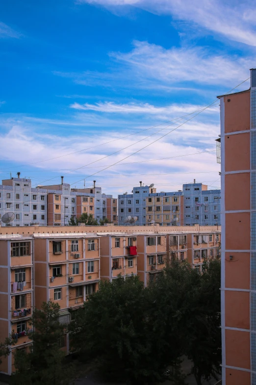 an outside view of a town block with buildings in the background