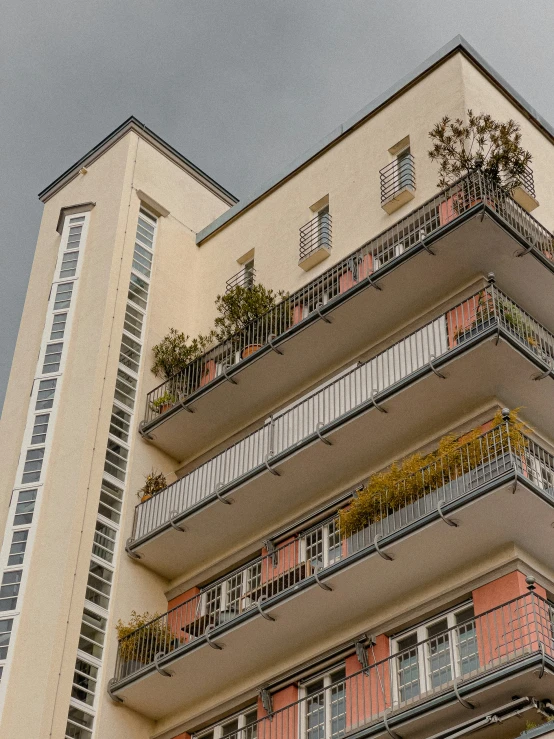 an old fashioned building with a balcony with flower boxes