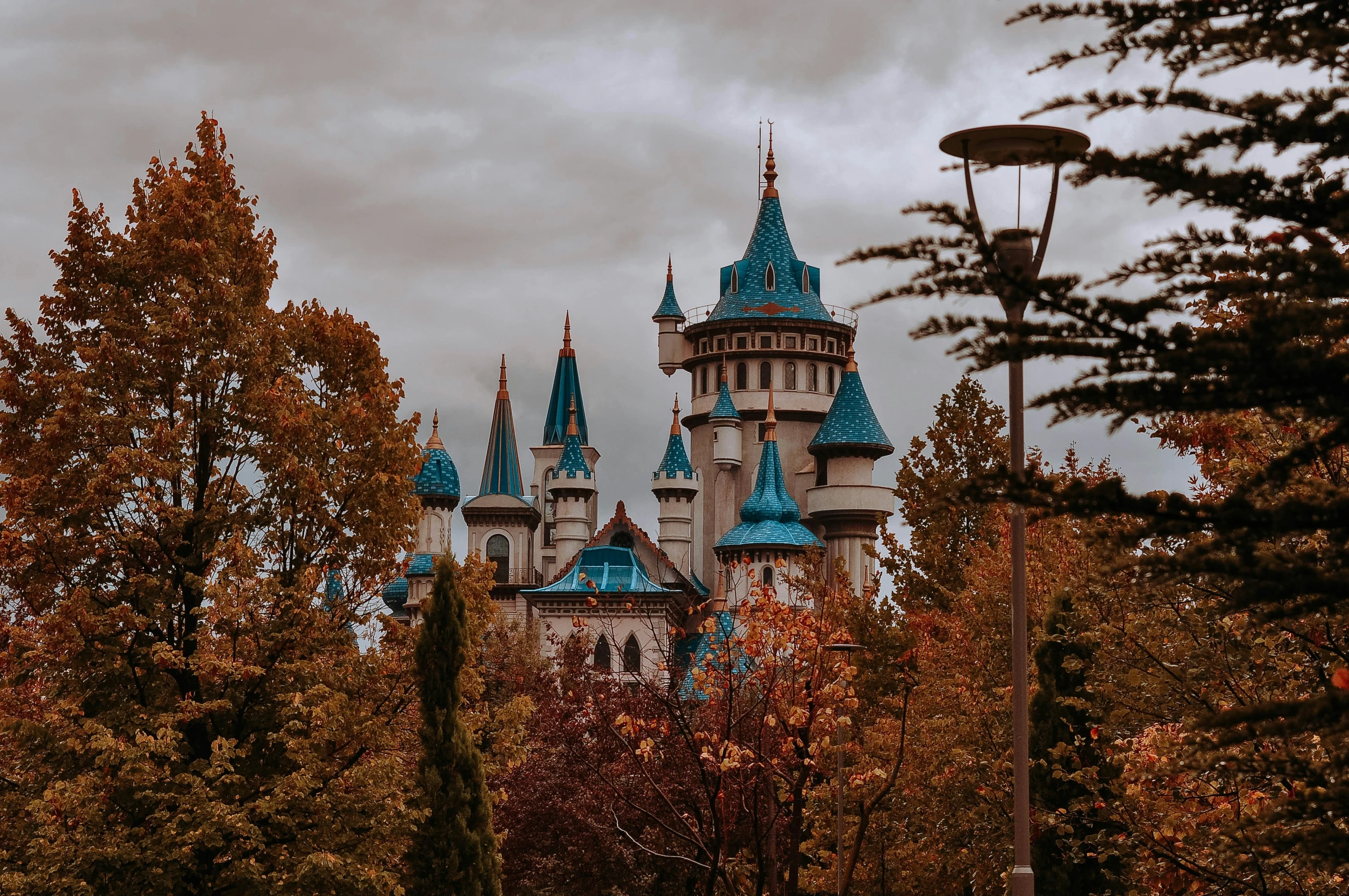 this is a picture of a large castle surrounded by trees