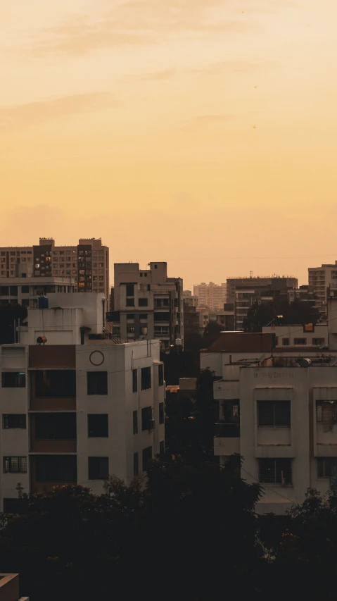 a plane that is flying over some buildings