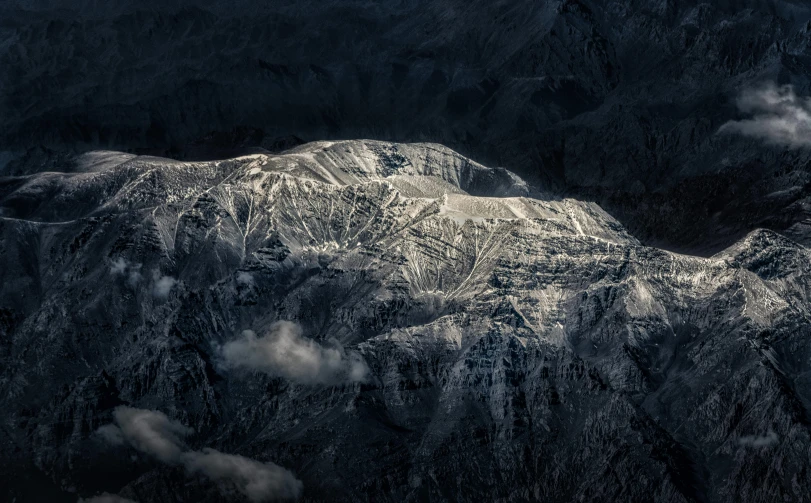 an airplane that is flying over the snow