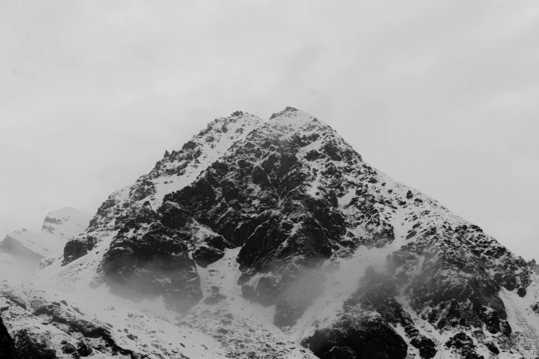 black and white po of a snow covered mountain peak