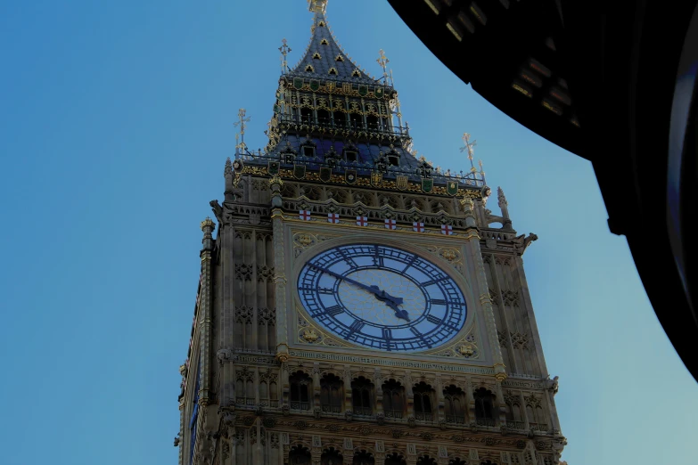 a large tower clock towering over a city