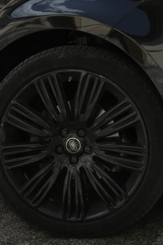 a car wheel sitting in the middle of a street