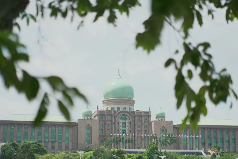 an old building that has a green dome