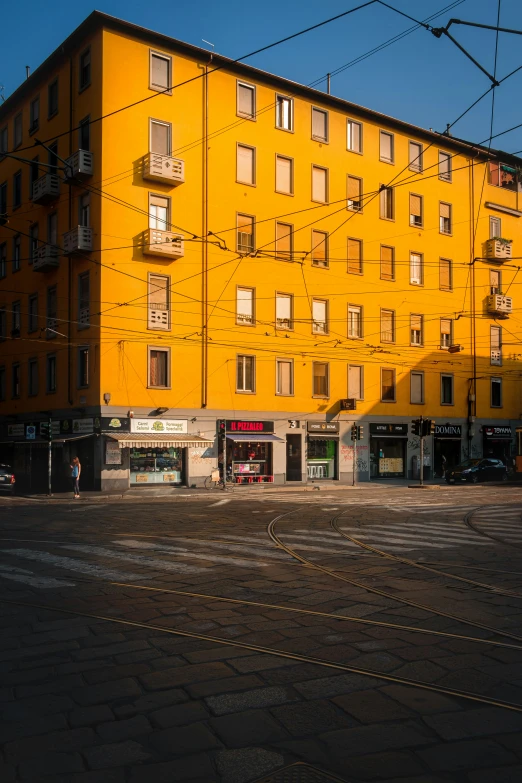 an image of a yellow building and a street