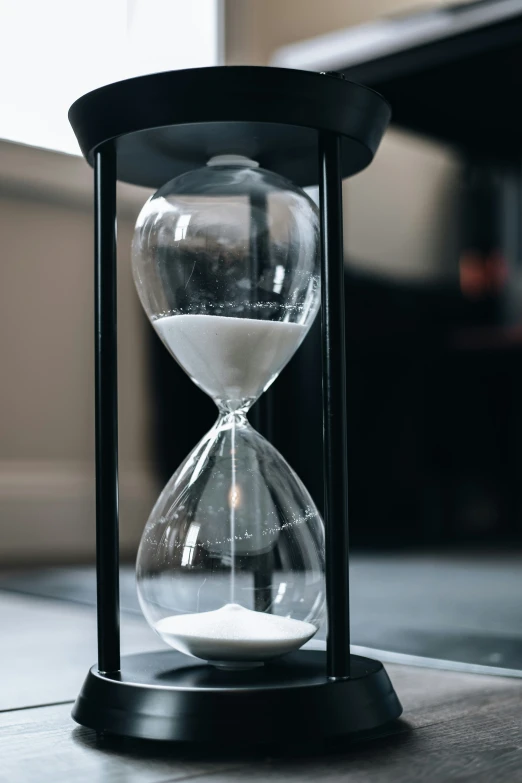 a black and white hourglass on a table