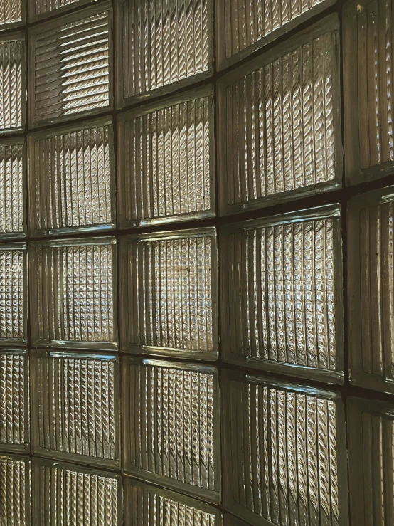 some small square glass squares arranged on wall