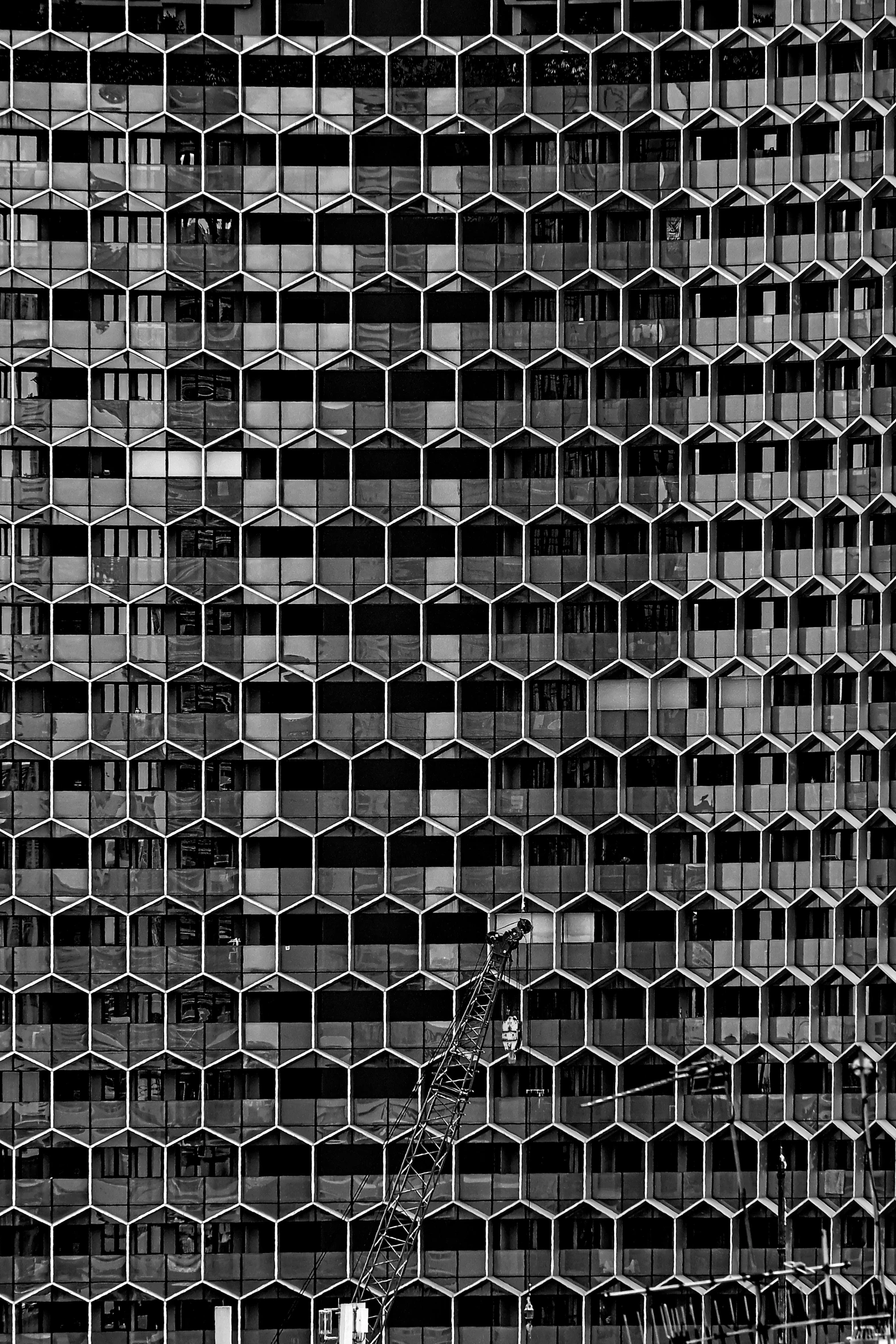 a dark black wall made up of shelving and a couple of keys on a key board