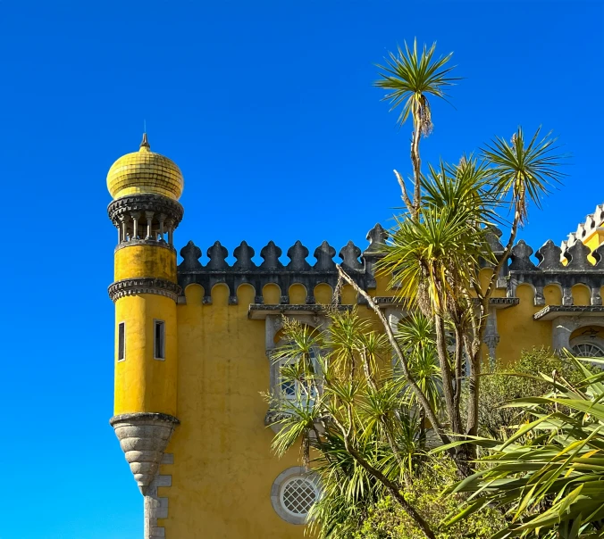 a tower with a clock in front of a sunny sky