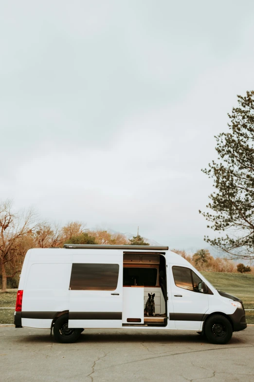 a van parked on the side of the road in the countryside