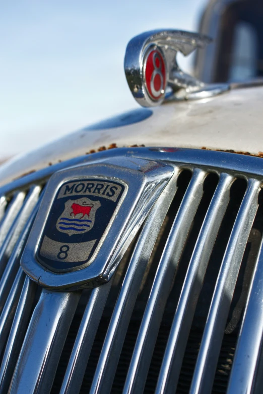 a close up image of an old chrome car