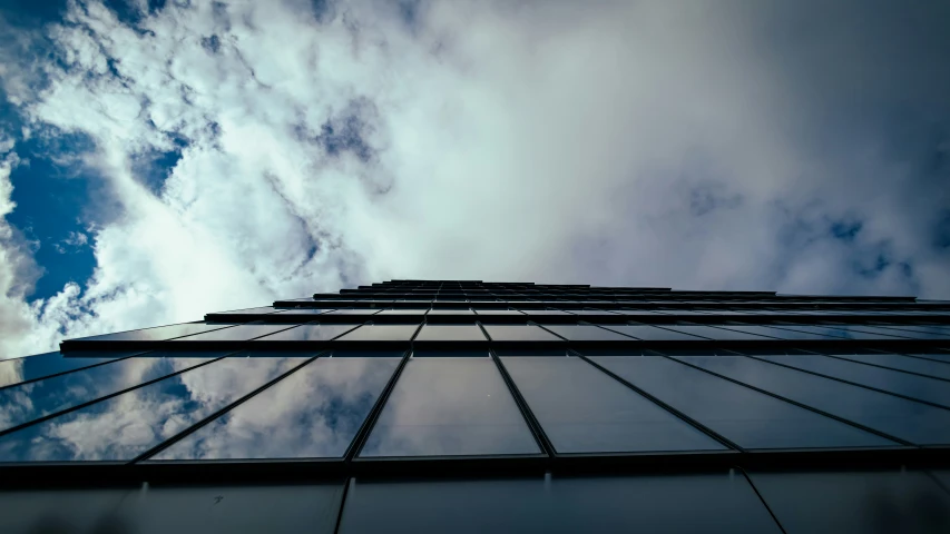 an upward view of a glass fronted building