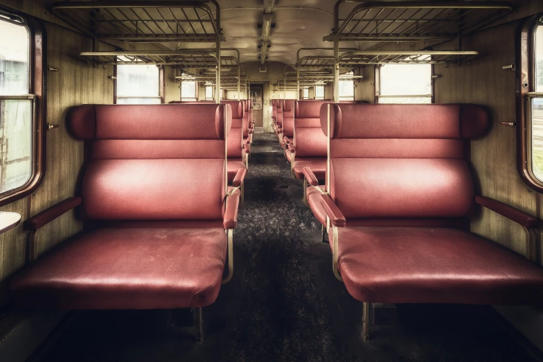 empty seats on an old looking train car