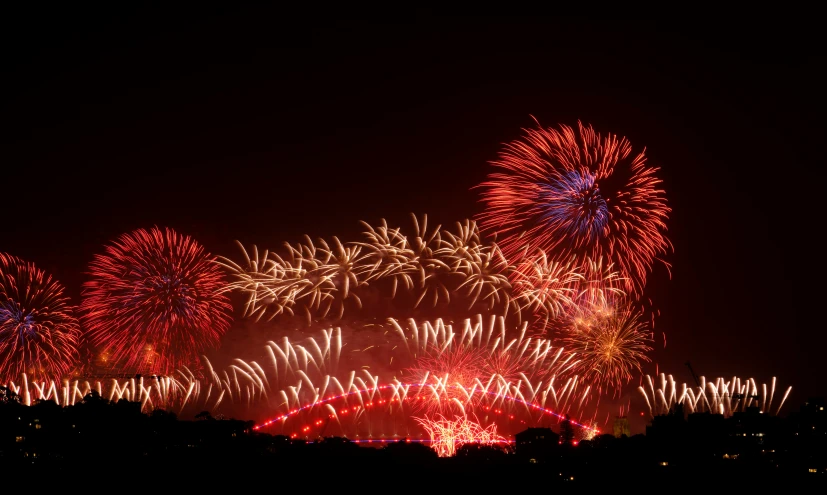 fireworks exploding and bursting in the sky at night