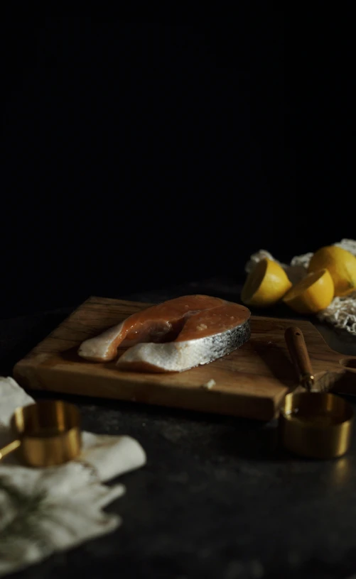 a wooden  board topped with slices of cheese