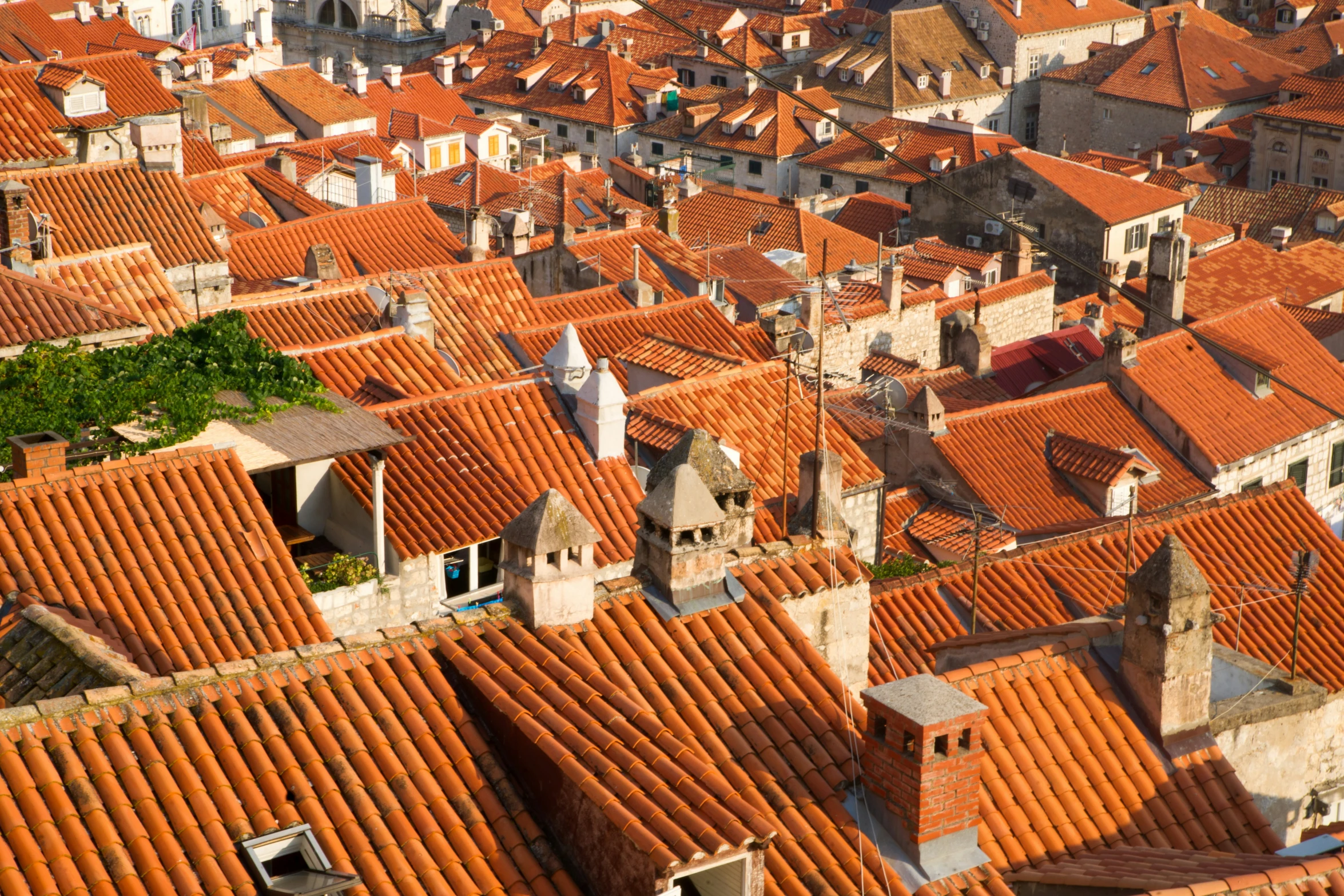 red tiled roofs in old city, seen from up high