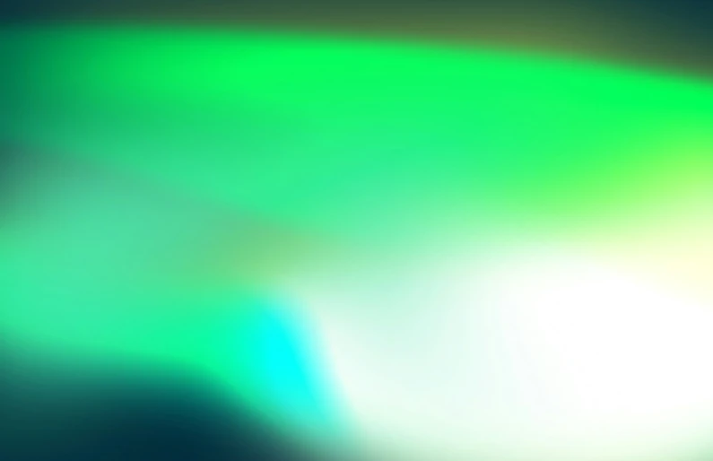 blurry pograph of bright green and blue light