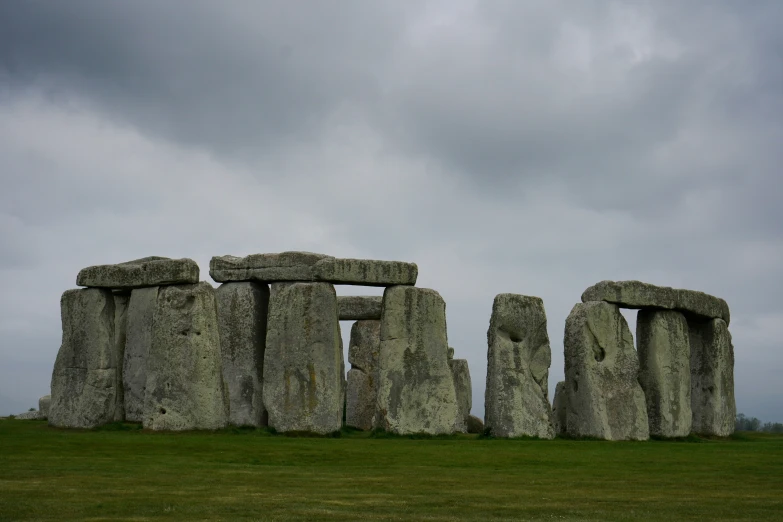 two large stones stand near each other against the sky