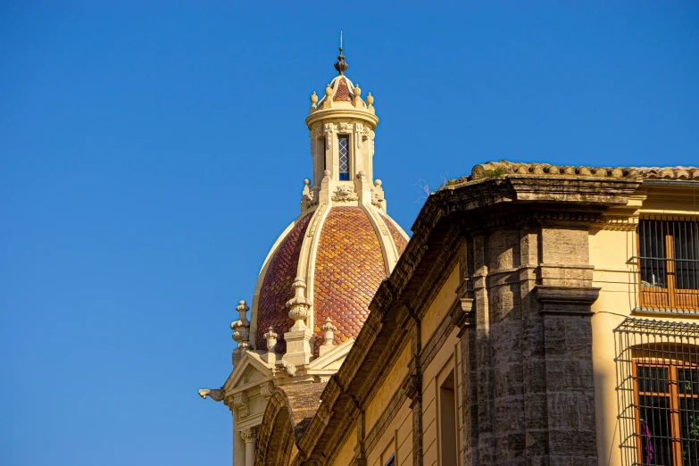 a building with a tower with a steeple, and clock