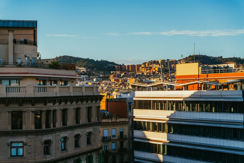 view of a city with buildings and hills