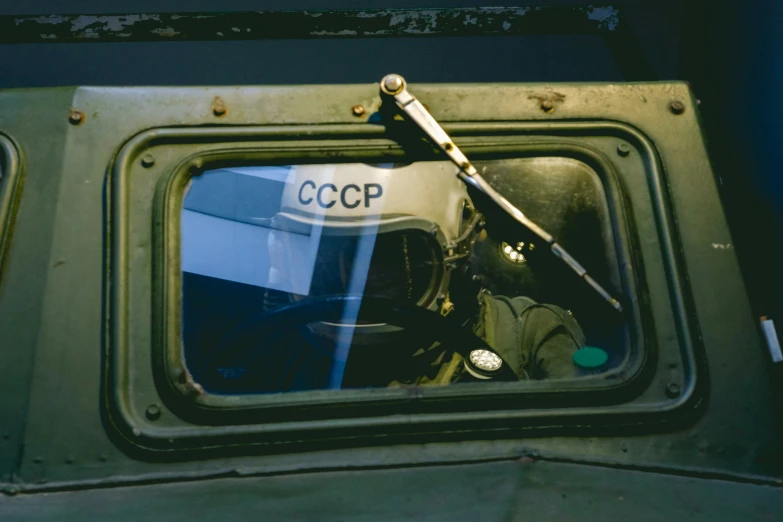 the view from the front seat of an old vehicle with the mirror